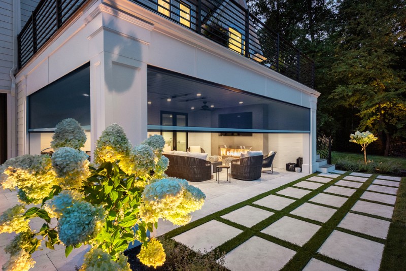 Motorized Screen Georgia Luxe Outdoors Atlanta - White house with a fire pit and a white flower bush